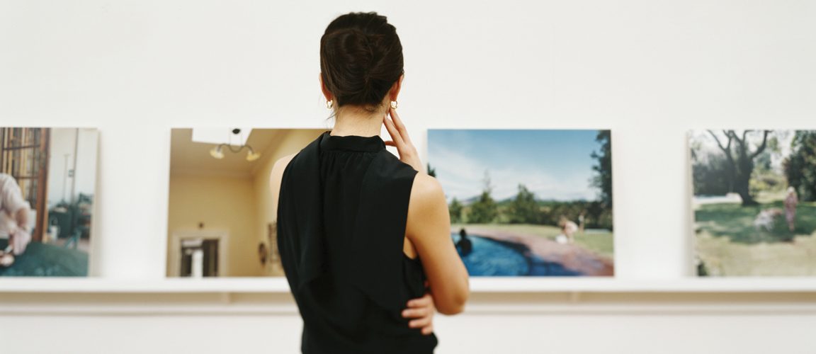 Woman viewing art gallery