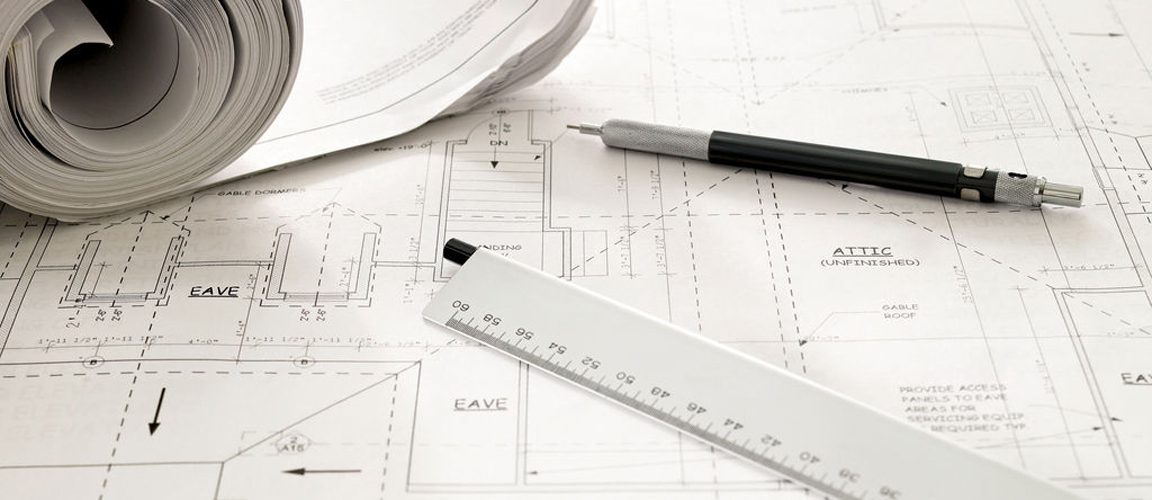 Pencil and ruler on blueprints