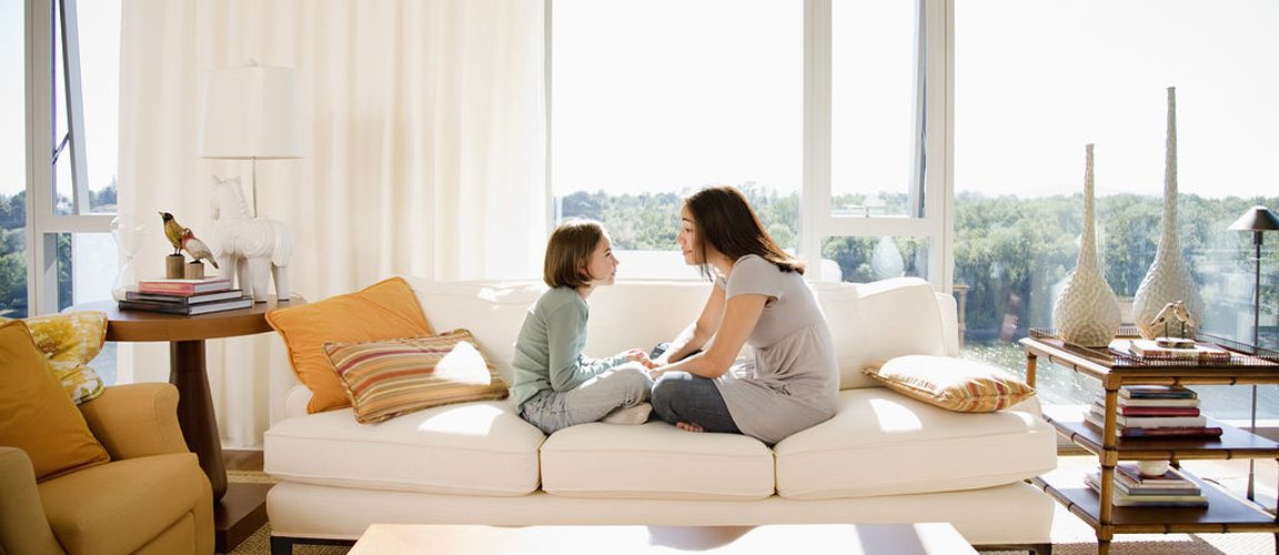 Mother/Daughter talking on couch