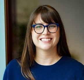white woman smiles at camera