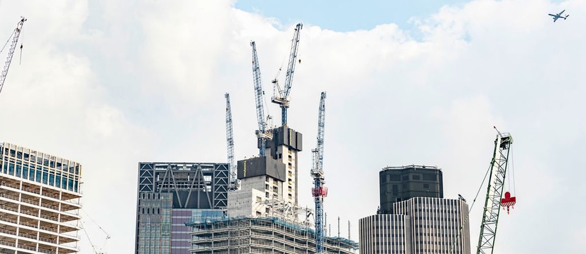 Exterior view of buildings and cranes